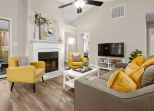 Residential cleaning service vacuuming a carpeted bedroom floor