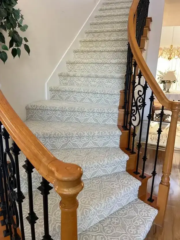 Curved carpeted stairs cleaned by J&J Steam Cleaning in Delaware