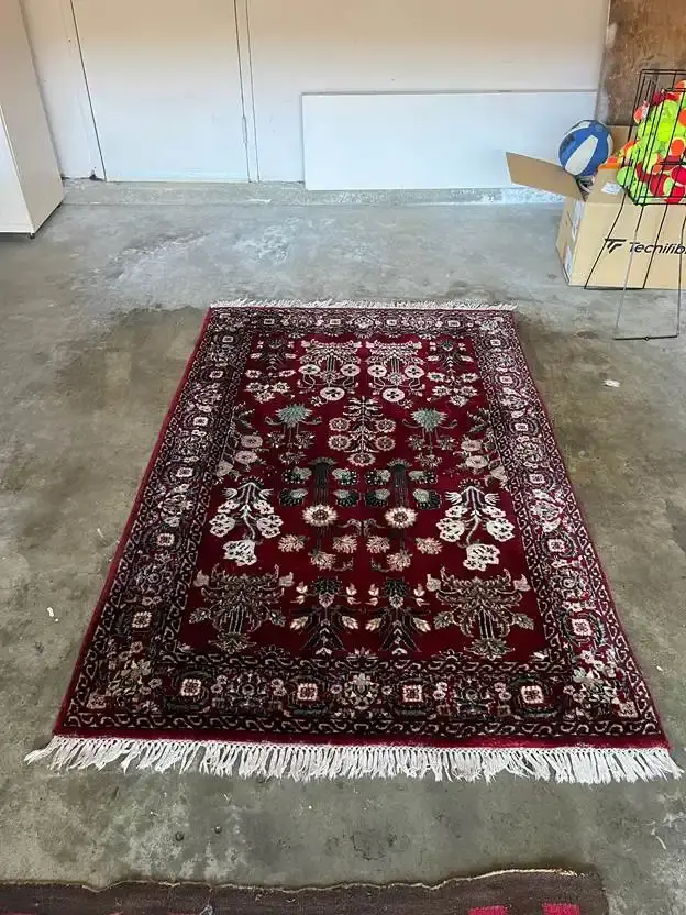 Red Persian-style rug after deep cleaning in New Castle County, DE